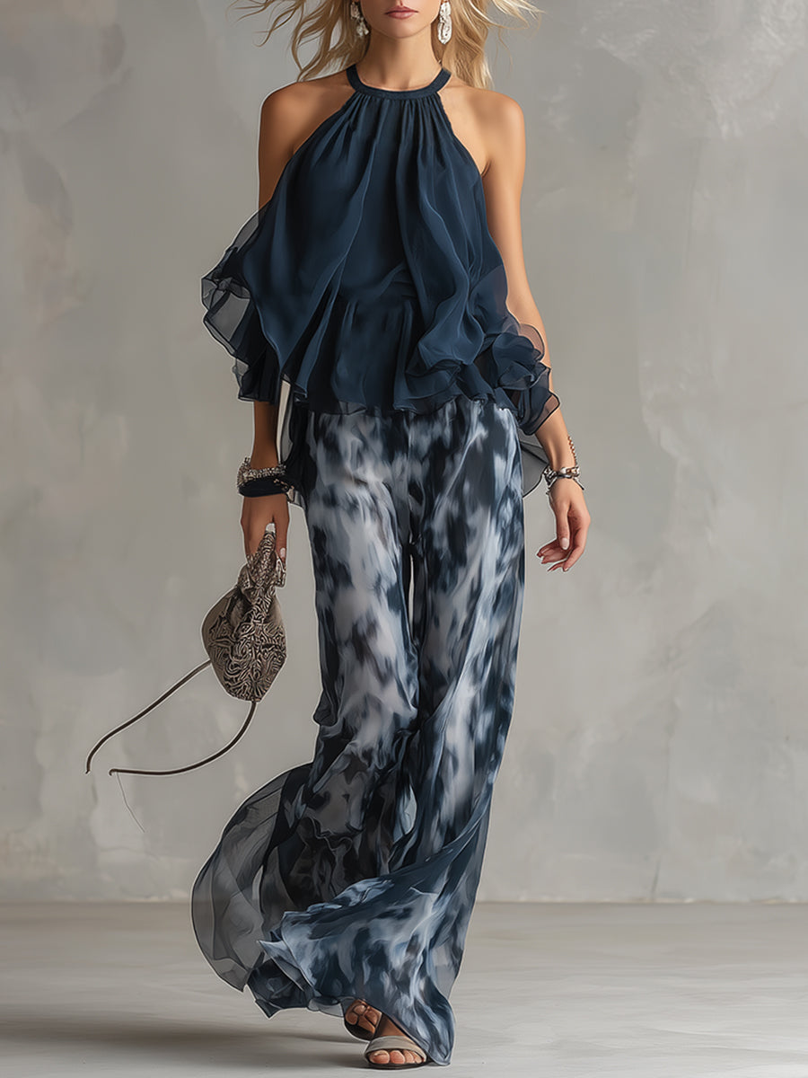 Chloé | Completo elegante con top a schiena nuda blu navy e pantaloni larghi stampati